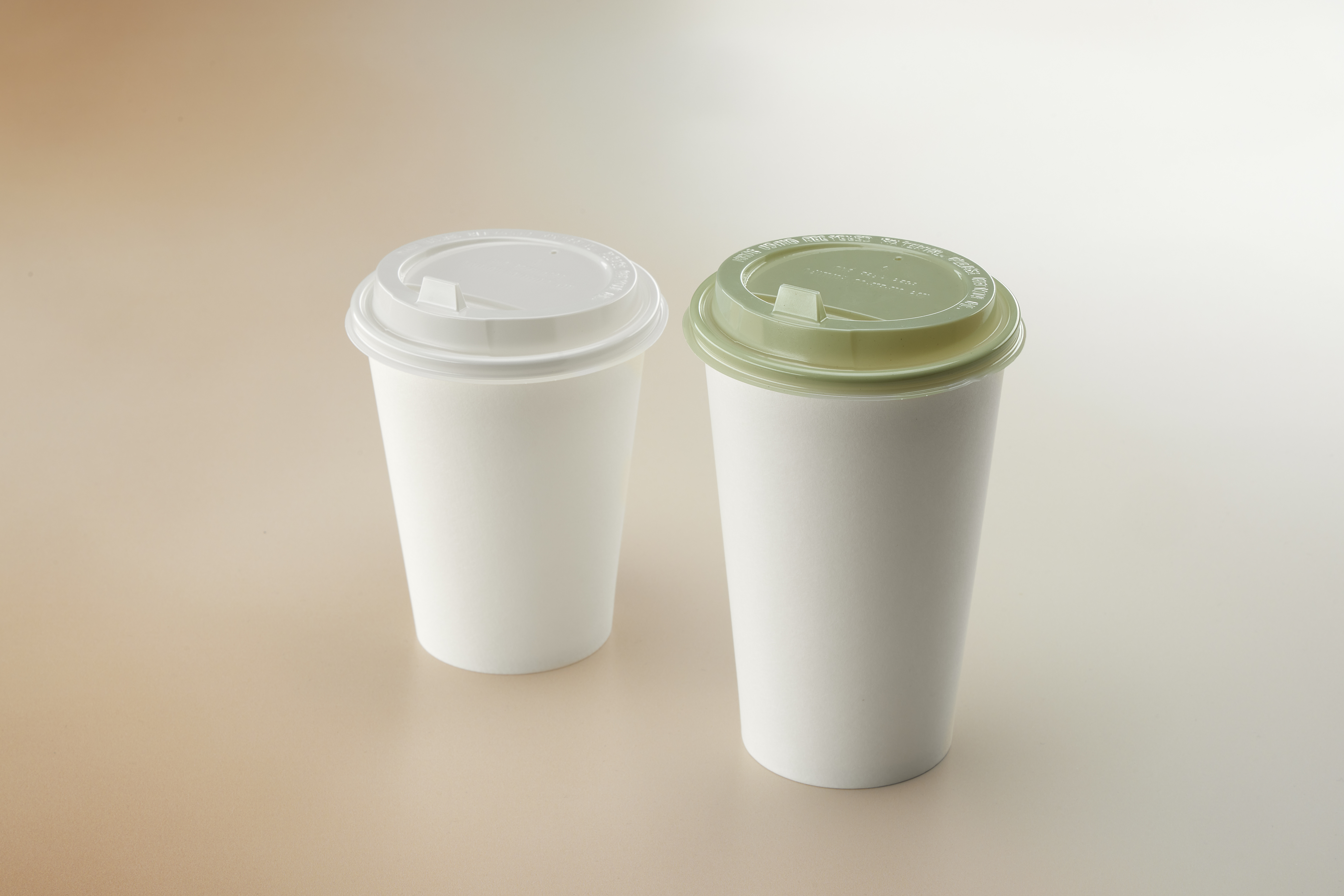 White and Evolve green PET hot cup lids